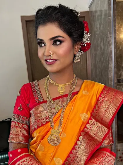 A classic Maharashtrian bridal look. I created sharp, defined eyes and paired them with a traditional hairstyle and the iconic crescent bindi.