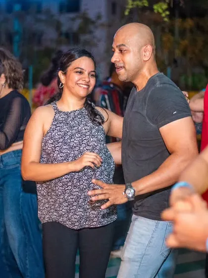 A special moment with an expecting mother enjoying a gentle dance. It shows our community is inclusive and caring.