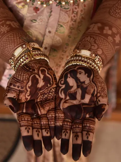 A close-up showing the deep, rich stain of a couple portrait mehendi. Using only organic henna ensures this beautiful color, which is completely safe during pregnancy.