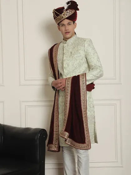 The complete ensemble of our mint green sherwani, showing how the rich stole adds a layer of sophistication and contrast.