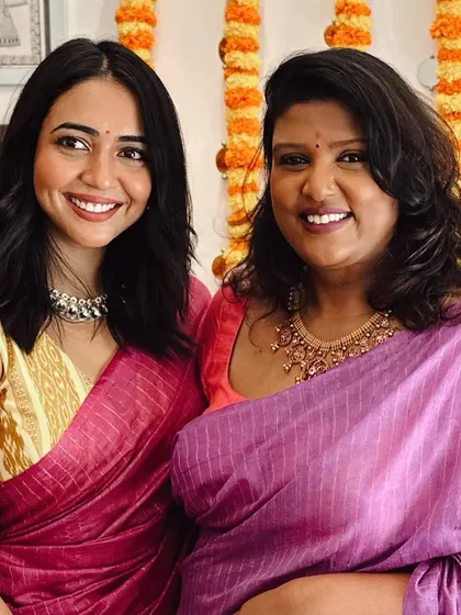Celebrating Dasara with friends. I'm wearing a pink handloom saree with a custom orange blouse, surrounded by the people who make my heart full.