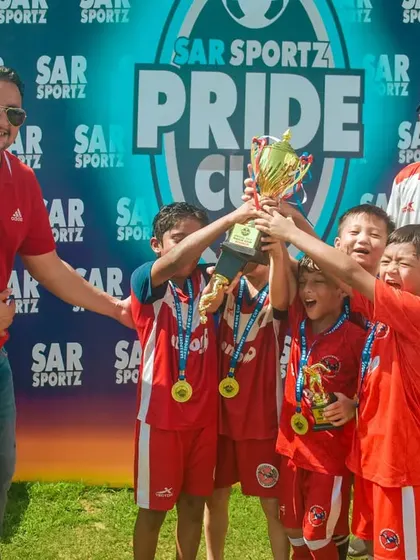 The joy of lifting the trophy together as a team.