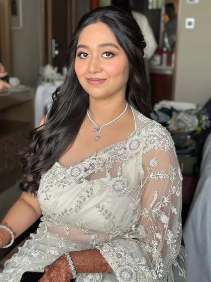 A beautiful portrait of the bride-to-be. Her makeup is timeless and elegant, making her look and feel her best for her Roka.