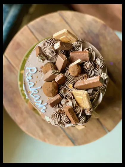 A top-down view of the Chocolate Overload cake, showing the variety of toppings.