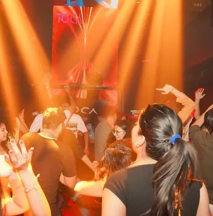 The dance floor was packed with people moving to the beat.