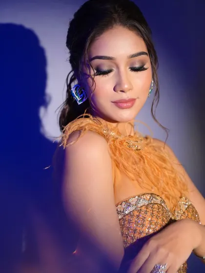 An eyes-closed shot showcasing the beautifully blended smokey eye. This is a perfect example of ultra-glam makeup.