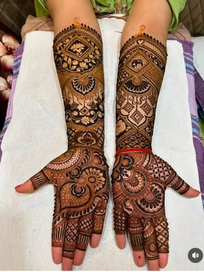 This design features an elephant motif on one arm and a lotus on the other, showcasing my ability to create asymmetrical yet balanced bridal looks.