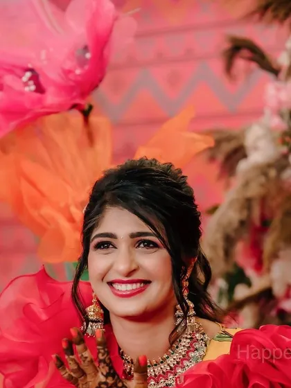 The intricate details of the bride's henna stand out against the colourful decor. I always aim to create a backdrop that complements the bride's attire and the ceremony's traditions.