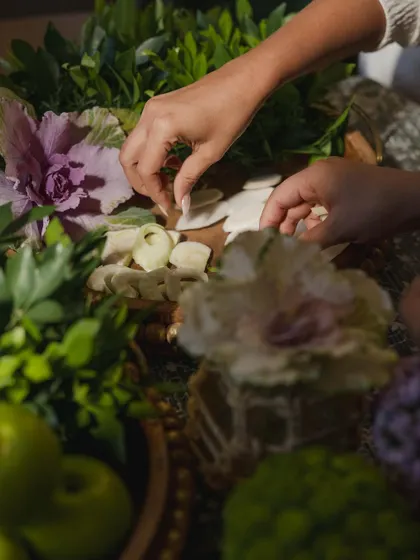 A behind-the-scenes shot of our team arranging the green-themed decor, showcasing the hands-on effort that goes into creating these beautiful setups.