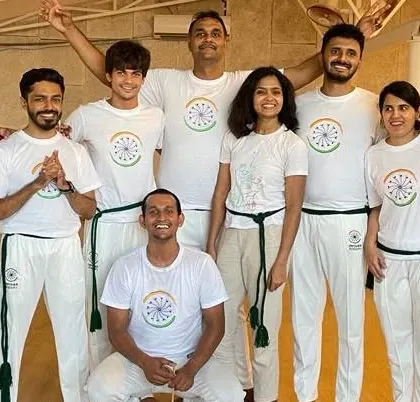 A proud moment with our students after a Capoeira Fest and Batizado weekend. Celebrating progress and camaraderie is a huge part of our culture.