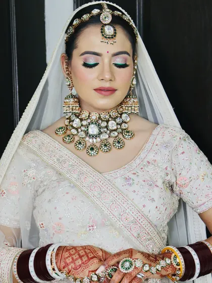The bride's serene expression, with the focus on the beautiful eye makeup.