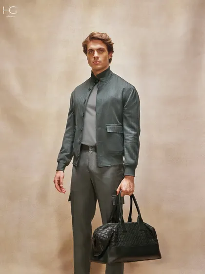Traveling in style has never looked this good. This look is completed with a luxurious quilted leather travel bag, the perfect accessory for a weekend getaway.