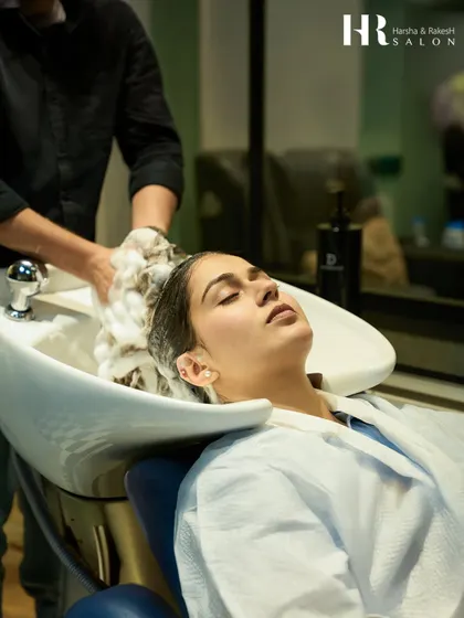 A moment of pure bliss during a hair wash and treatment. I believe in providing a serene and comfortable experience for every client.