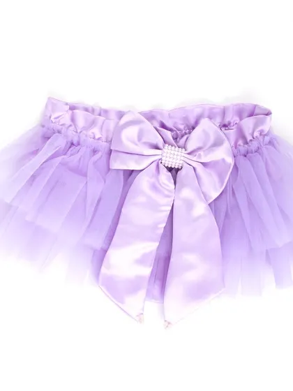 A product shot of the lavender tutu skirt with a large bow.
