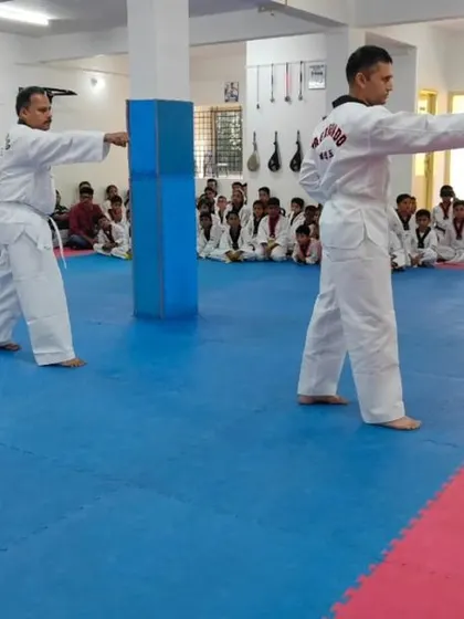 Two senior students demonstrate a punch.