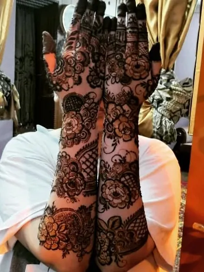 Another happy client showing off her full floral henna. The dark, rich paste creates a beautiful and bold look.