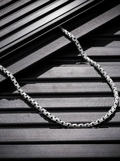 This shot for Orionz Jewels highlights our skill in capturing difficult subjects like metal and intricate details. Using textured black panels and directional lighting, we created dramatic shadows and contrast to give this men's chain a bold, masculine, and high-end feel.