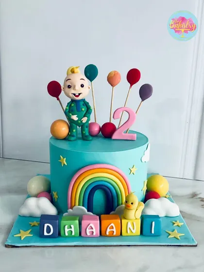 This adorable Cocomelon cake is perfect for Dhaani's 2nd birthday. With JJ, a bright rainbow, and colorful blocks spelling out her name, it’s sure to be a hit!