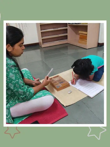 With intense focus, Manvitha practices her writing skills. This is a wonderful moment for her mother to see the progress she is making in her language development.