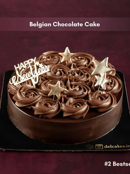 Our Belgian Chocolate Cake, another bestseller for New Year's, decorated with a "Happy New Year" topper and golden stars.