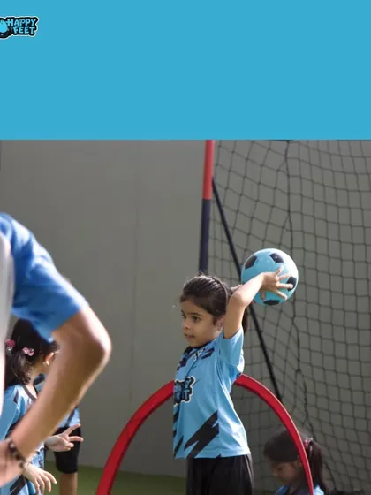 A little moment captured during a throwing drill. Her focused expression and big effort result in big smiles all around. It's these small achievements that build confidence.