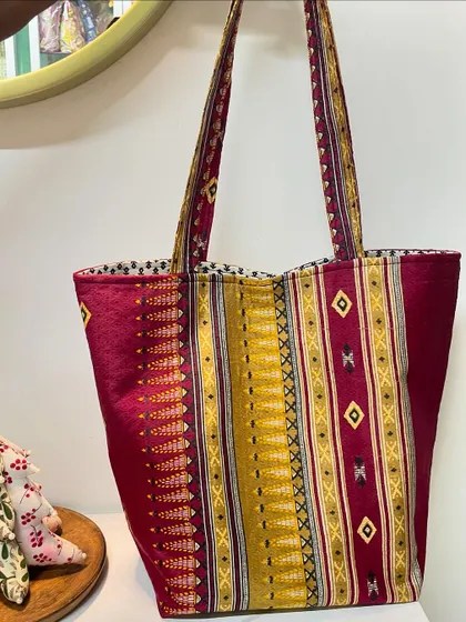We love giving old treasures new life. This stylish and sturdy tote bag was crafted from a client's treasured saree pallu, blending traditional fabric with a modern, practical design.