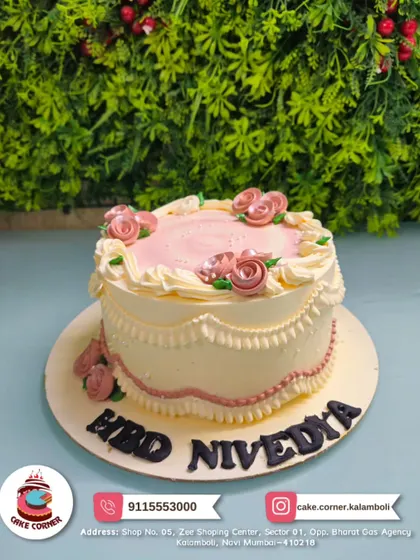 A vintage-style cake with delicate pink and white piping and roses for Nivedya's birthday. This classic design is timeless and full of charm.