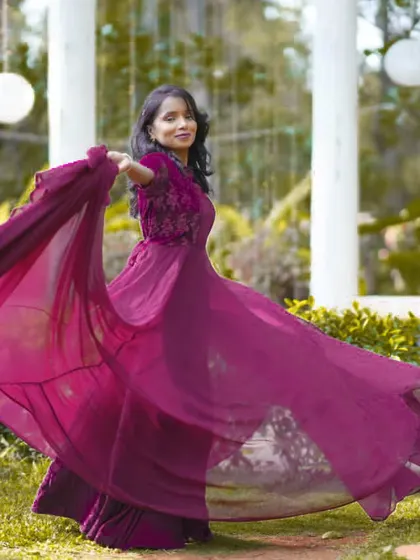 A candid, joyful twirl showing off the beautiful flow of the purple gown. I ensure my clients feel comfortable and can move freely in these dramatic outfits.