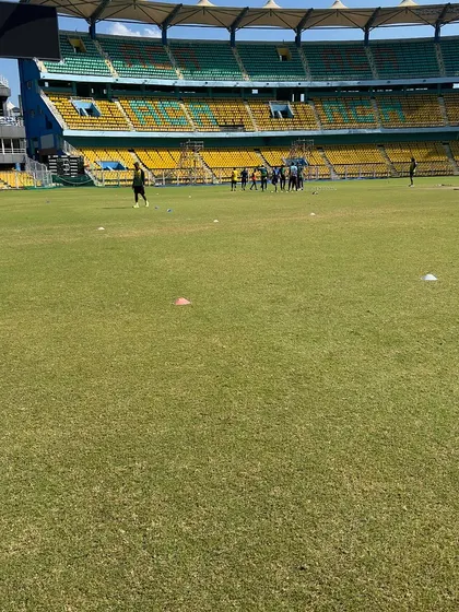 Another perspective of the team training in the vast stadium.