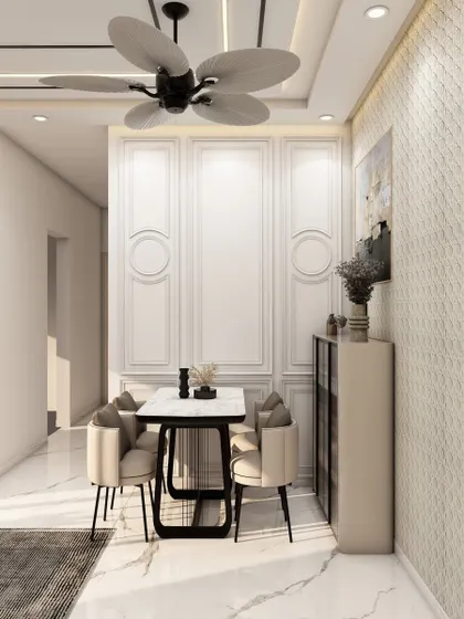 Adjacent to the living area, this compact dining setup for four features elegant wall paneling and a textured accent wall, proving that small spaces can be rich in detail.
