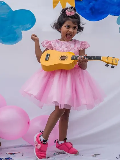 Rocking out in a pink tulle dress. This image perfectly captures the spirit of my brand: creating beautiful dresses that girls can have fun and be themselves in.