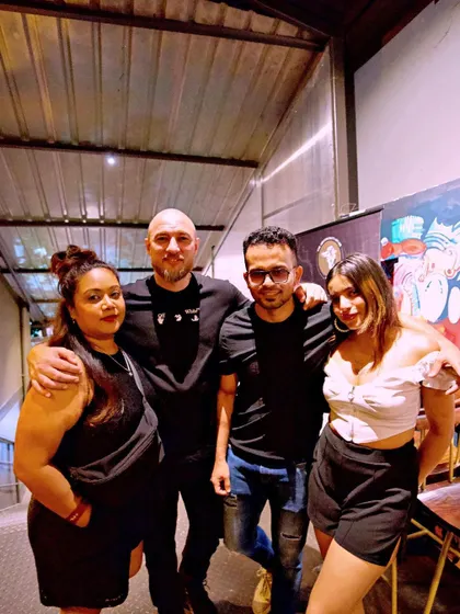 A group photo with friends at the entrance of 10SpeakEasy.