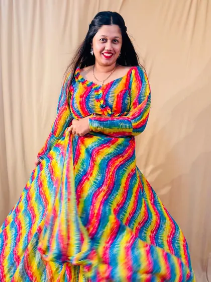 This colourful carnival lehenga is a fantastic choice for a Mehendi or Sangeet night. The rainbow pattern is so unique and full of energy.