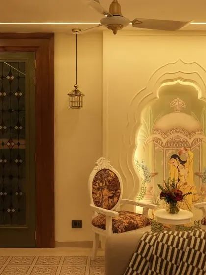 A heritage-themed seating area with ornate chairs and a wall mural depicting a traditional scene. This space is perfect as a quiet corner for conversation, showcasing our ability to incorporate artistic and cultural elements.