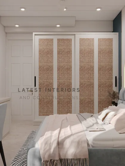 This shot highlights the sliding wardrobe with natural cane-finished panels, adding a touch of organic texture to the modern bedroom design.