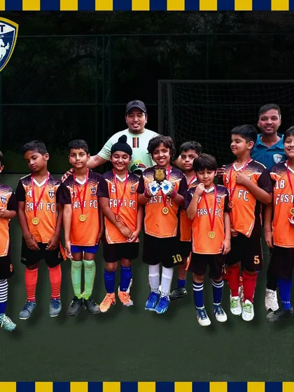 Our U13 team and coaches pose with their medals after winning the Millennium Football Tournament in Gurgaon.
