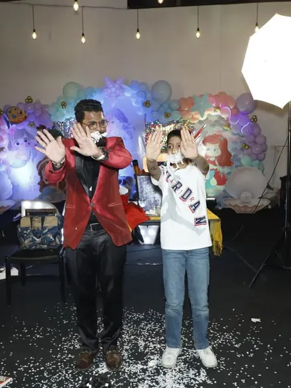 The grand finale of the paper-from-mouth trick. This is a perfect example of the hilarious and visual comedy I bring to every performance, engaging both the volunteers and the audience.