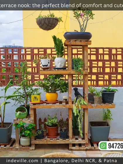 A cozy terrace nook designed for comfort. I used a custom wooden shelf to create a multi-level display for various cute planters, complemented by a swing set and patterned tile flooring for a pretty and peaceful vibe.