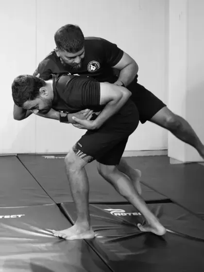 This image shows the setup for a takedown. We teach our students how to close the distance, gain control of an opponent's center of gravity, and execute a throw.