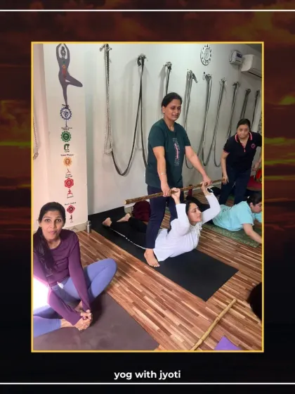 Using a stick to assist a student in Bhujangasana (Cobra Pose), ensuring a safe and effective backbend.