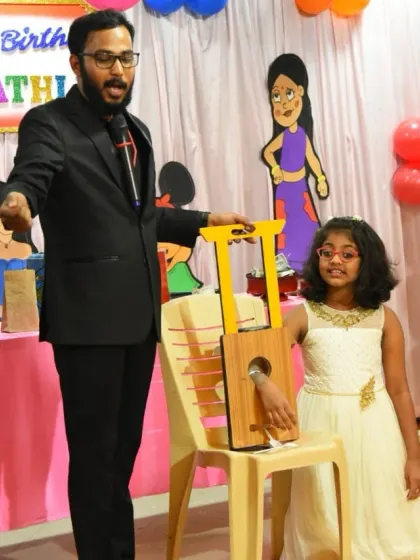 This one always gets a gasp from the crowd. A brave volunteer puts her hand in my magical guillotine. Don't worry, she came out completely fine!
