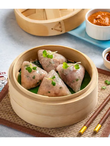 Triangle-shaped steamed dumplings, showcasing a unique shape and presentation.