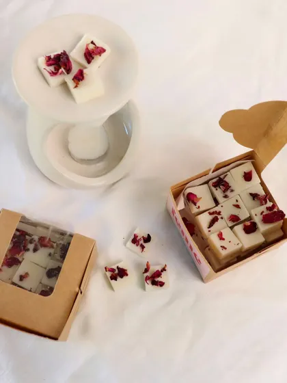 Rose petal wax melts, shown with our diffuser and eco-friendly kraft paper packaging.