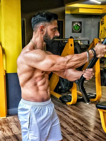 Performing a chest press variation. Every exercise is chosen to target specific muscle groups for maximum growth.