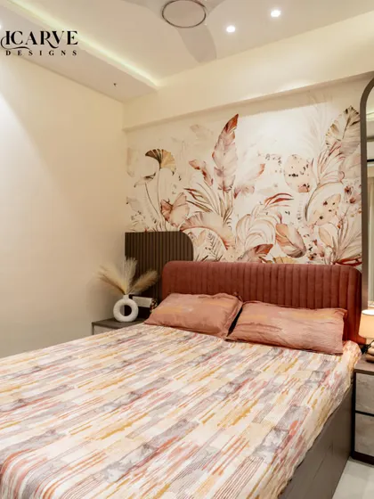 A full view of the bed and feature wall, showcasing the balance of pattern and simplicity.