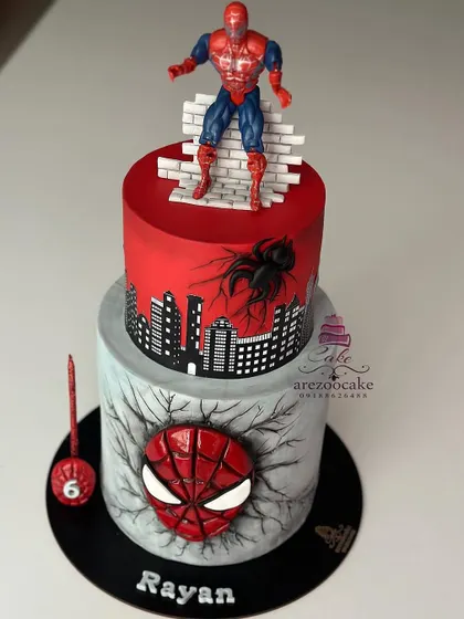 This two tier Spider-Man cake is so cool, with a cracked effect on the bottom tier and a city skyline on top. The details make this custom cake a standout choice for any superhero fan's celebration.