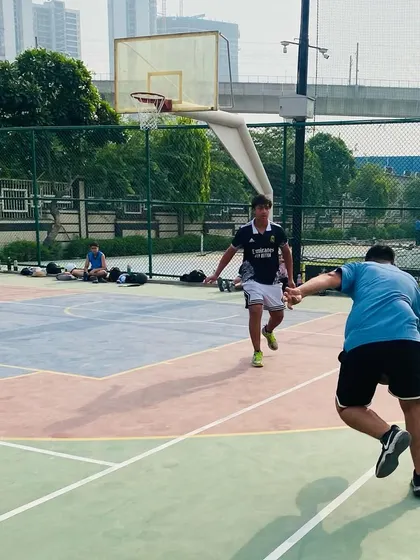 Defensive footwork in action as a player stays in front of the ball handler.