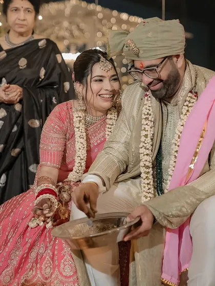 Laughter and joy during the post-wedding games, a candid moment that shows the couple's fun and playful side.