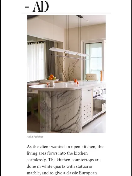 Another snippet from our Architectural Digest feature, highlighting the open kitchen and the use of Statuario marble.