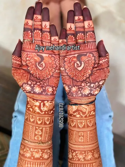 I guarantee a deep, rich henna stain with my 100% natural paste. This photo shows the beautiful dark color you can expect, featuring classic peacock and lotus designs that are perfect for a bride.